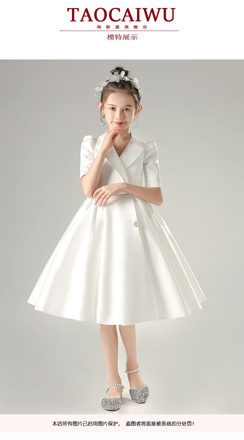 White satin girls dress with a tuxedo lapel collar, puff half sleeves and a full knee-length skirt, designed for weddings and recitals, view 7
