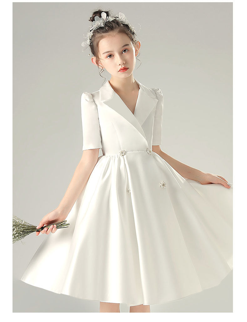 White satin girls dress with a tuxedo lapel collar, puff half sleeves and a full knee-length skirt, designed for weddings and recitals, view 9