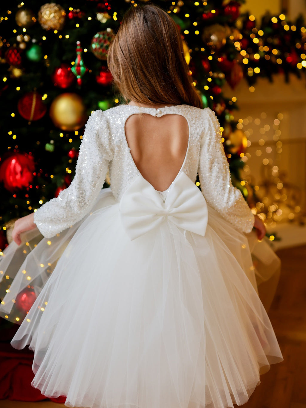 White sequin girls tutu dress with long sleeves, heart open back and satin bow, designed for Christmas and weddings, view 3