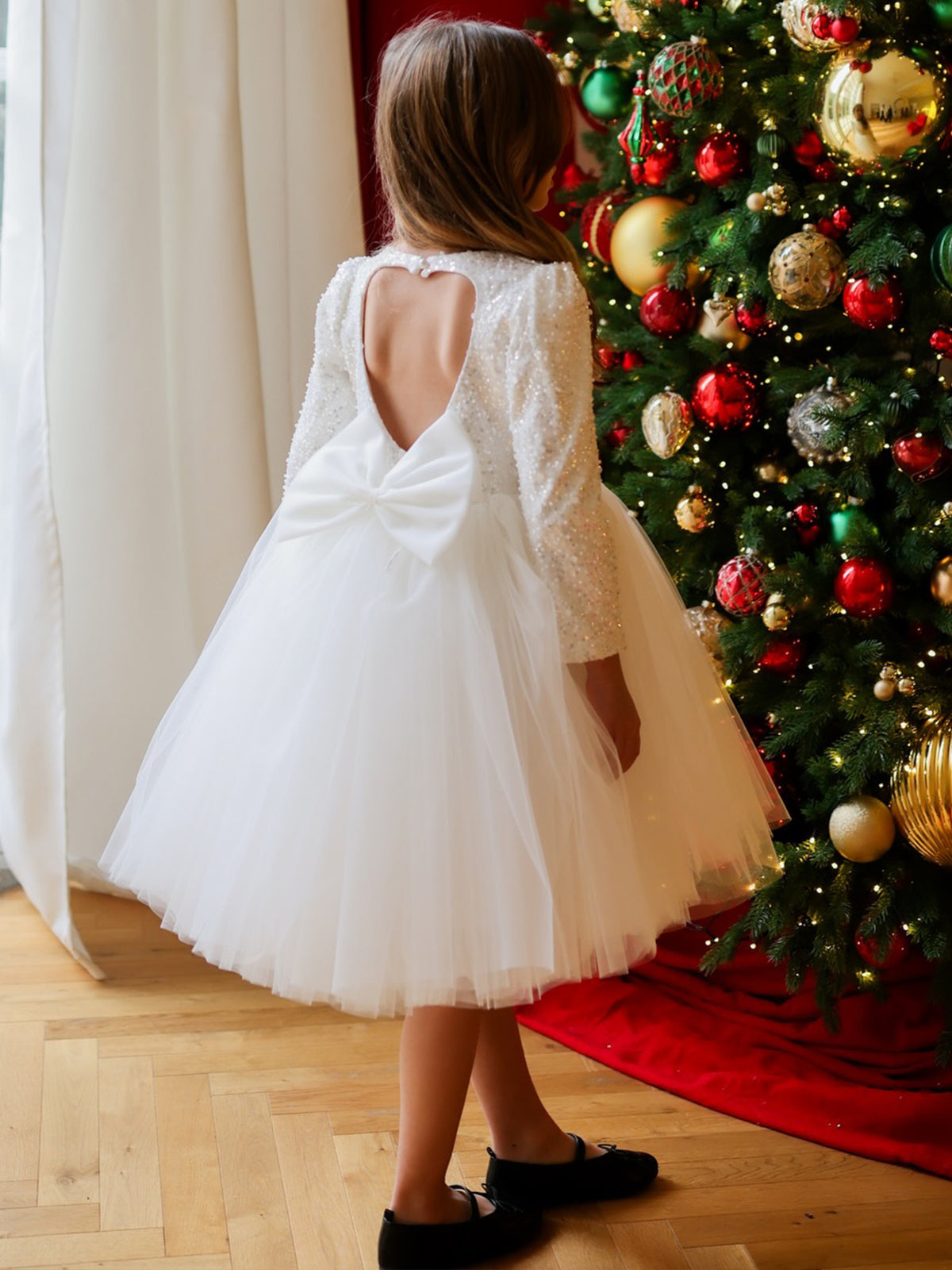 White sequin girls tutu dress with long sleeves, heart open back and satin bow, designed for Christmas and weddings, view 4